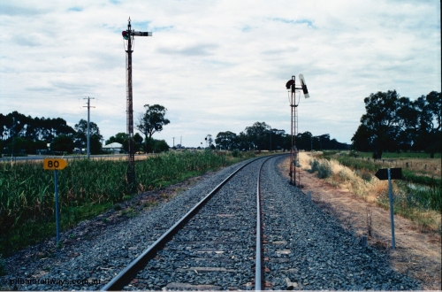 156-25
Numurkah, Picola Junction looking north, up home semaphore signal posts for the Picola line at left and the Strathmerton line on the right, I'm standing on the Strathmerton line and the up home signal is pulled off, 80 km/h speed board.
