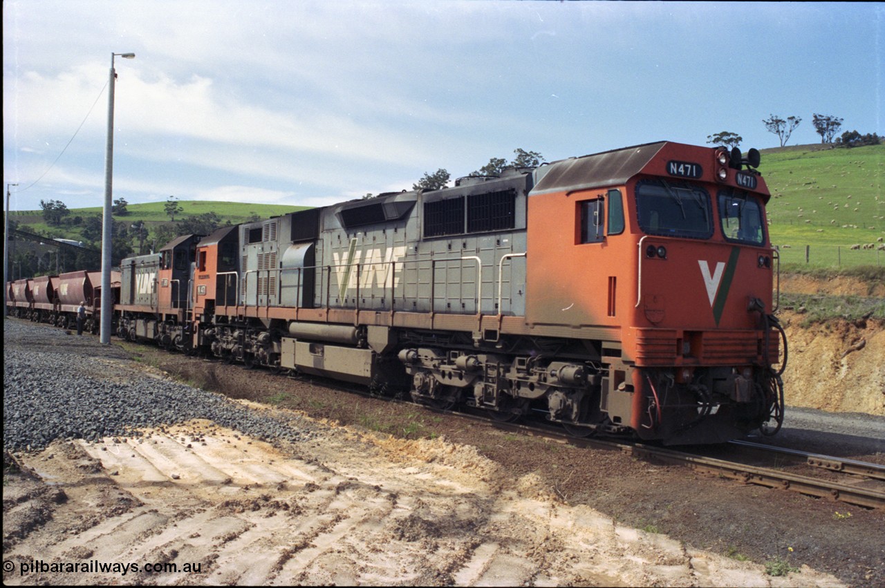 157-10
Kilmore East, Apex Quarry Siding, V/Line broad gauge locomotives N class N 471 'City of Benalla' Clyde Engineering EMD model JT22HC-2 serial 87-1200 and T class T 390 Clyde Engineering EMD model G8B serial 65-420 prepare to couple back onto their train having competed the run round.
Keywords: N-class;N471;Clyde-Engineering-Somerton-Victoria;EMD;JT22HC-2;87-1200;