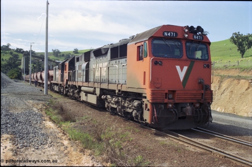 157-12
Kilmore East, Apex Quarry Siding, V/Line broad gauge locomotives N class N 471 'City of Benalla' Clyde Engineering EMD model JT22HC-2 serial 87-1200 and T class T 390 Clyde Engineering EMD model G8B serial 65-420 prepare to push back under the loading bins with the empty rake.
Keywords: N-class;N471;Clyde-Engineering-Somerton-Victoria;EMD;JT22HC-2;87-1200;