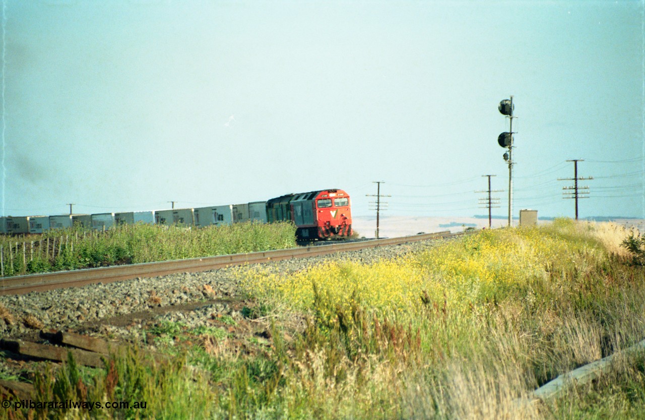 159-03
Bank Box Loop, distant view of a down Adelaide bound broad gauge goods train rounding the curve with the super elevation of the mainline visible being hauled by V/Line G class G 540 Clyde Engineering EMD model JT26C-2SS serial 89-1273 and Australian National 700 class 704 AE Goodwin ALCo model DL500G serial G6059-2.
Keywords: G-class;G540;Clyde-Engineering-Somerton-Victoria;EMD;JT26C-2SS;89-1273;