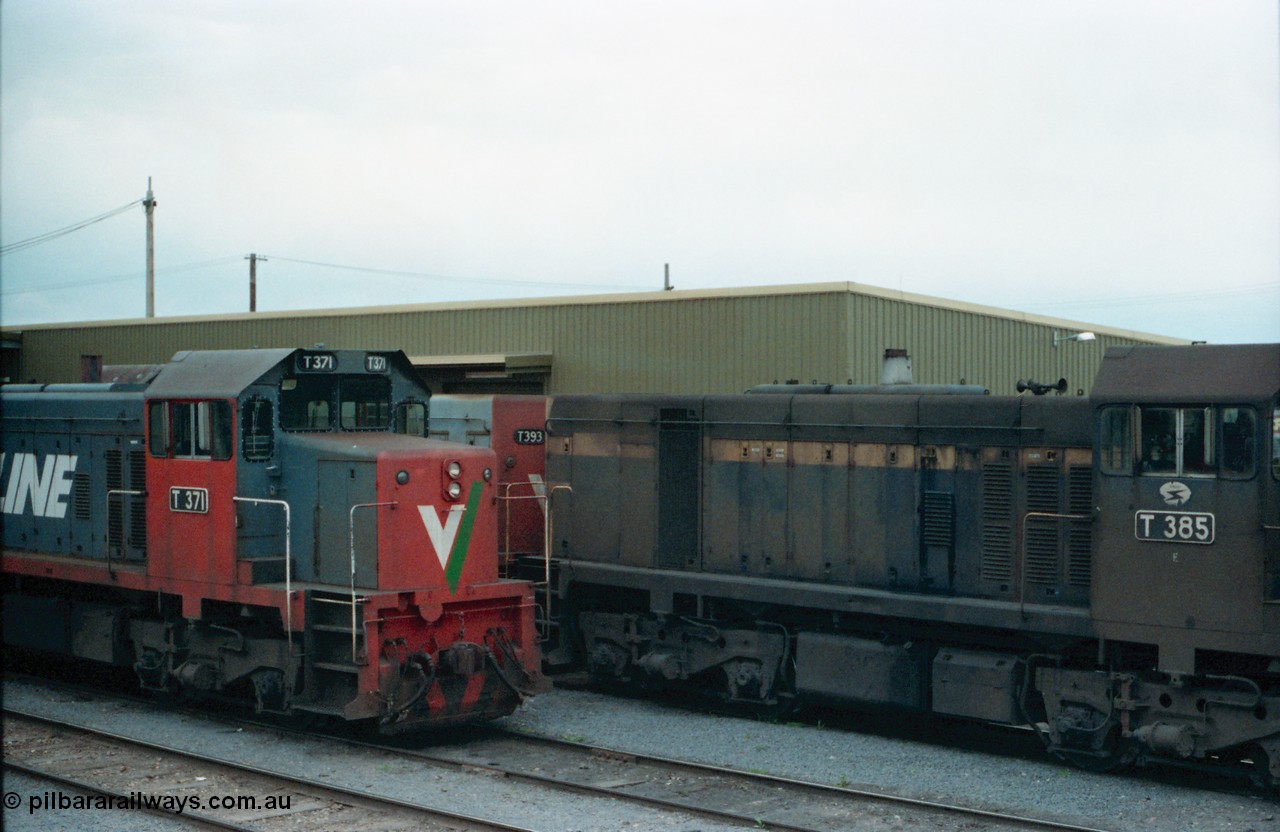 160-18
Shepparton, stabled V/Line broad gauge T class locomotives, T 371 Clyde Engineering EMD model G8B serial 64-326, T 385 serial 64-340 still in Victorian Railways livery of blue and yellow and T 393 serial 65-423.
Keywords: T-class;T371;Clyde-Engineering-Granville-NSW;EMD;G8B;64-326;