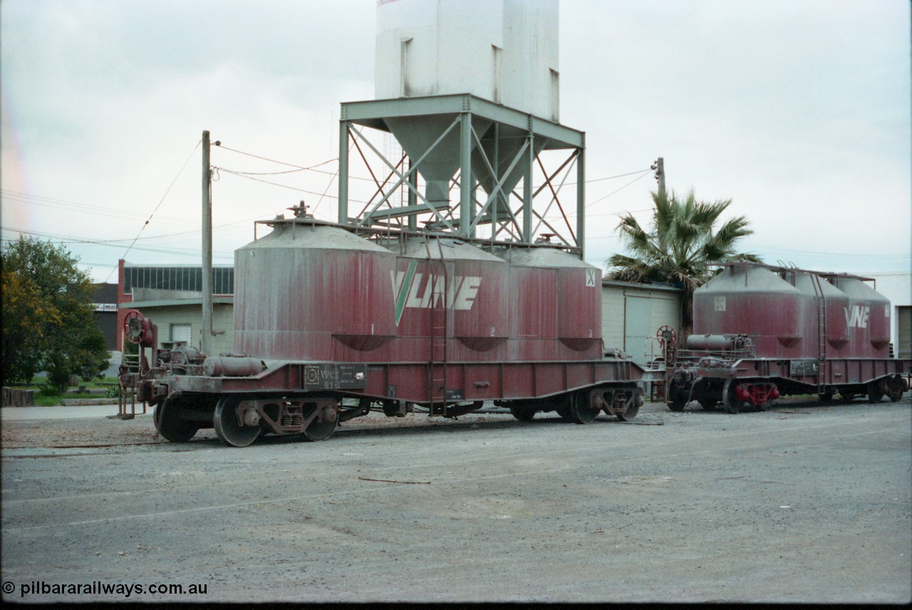 160-21
Shepparton, V/Line broad gauge VPCX bogie pneumatic discharge cement waggons VPCX 61 built in May 1976 as a JX type by Victorian Railways Newport Workshops and recoded to VPCX in 1979 and VPCX 132 built new by Victorian Railways Bendigo Workshops in December 1981, stand at the Australian Cement unloading and silos point in the yard between the goods shed and the works siding.
Keywords: VPCX-type;VPCX61;Victorian-Railways-Newport-WS;JX-type;