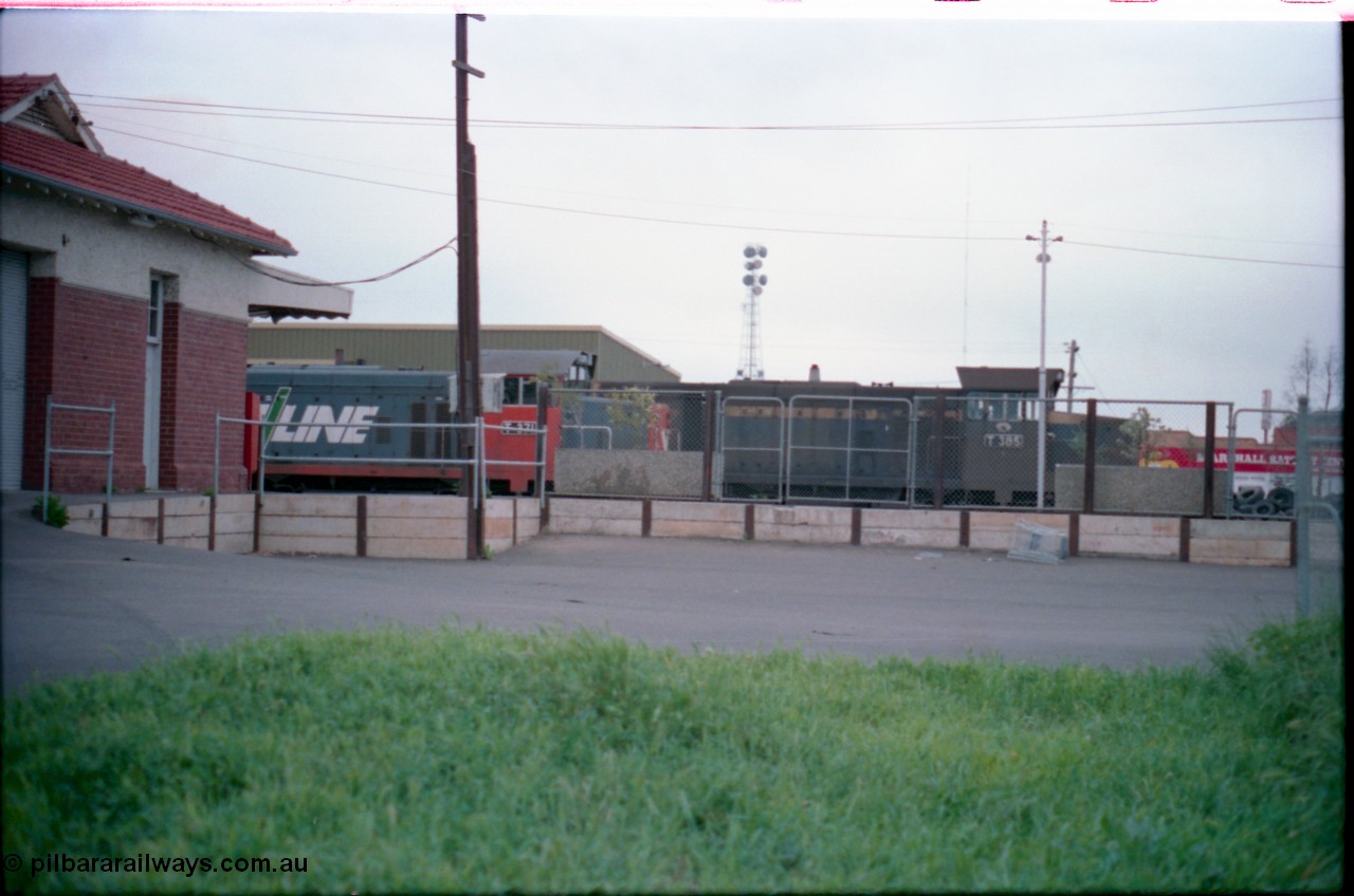 160-30
Shepparton, view from station car park at stabled V/Line broad gauge T class units T 371 Clyde Engineering EMD model G8B serial 64-326 and T 385 serial 64-340 still in Victorian Railways blue and yellow livery, goods shed behind locos.
Keywords: T-class;T371;Clyde-Engineering-Granville-NSW;EMD;G8B;64-326;