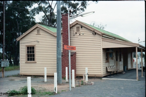 160-13
Mooroopna, platform view of the station building, shows fire place chimney and the various service connections to the building.
