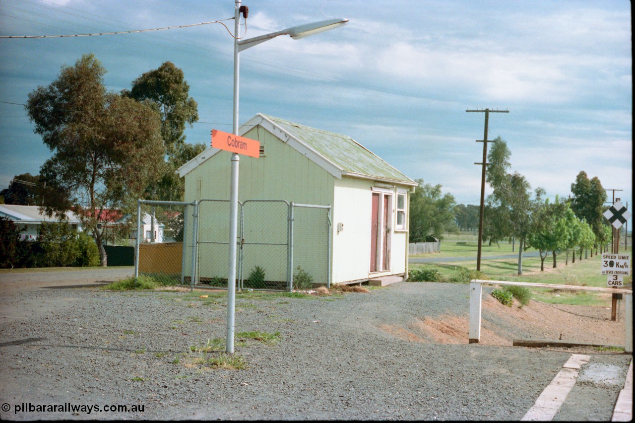 161-18
Cobram, view from platform of crew crib room looking south, speed board and grade crossing indicator at right.
