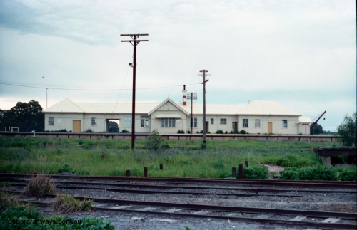 161-35
Tocumwal station building elevation from the dual gauge or NSWGR platform side, the tracks in front are broad gauge, while the ones in the middle between the post are standard gauge.
