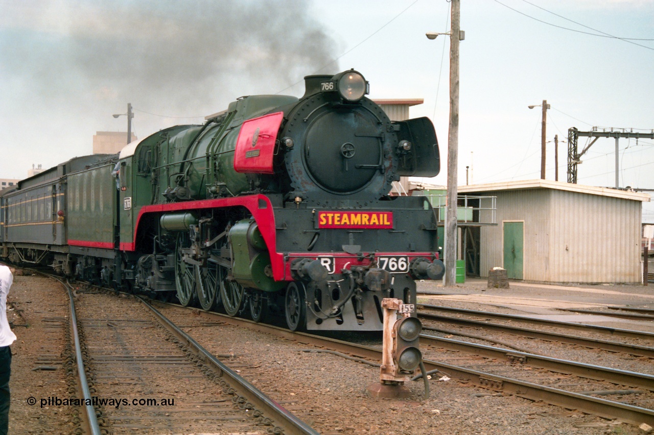 162-1-21
Spencer Street Station, broad gauge Steamrail R class R 766 North British Locomotive Company, Glasgow, Scotland model Hudson serial 27056 departs platform 4 with a down steam hauled passenger train during the PTC open Day, ground dwarf 155.
Keywords: R-class;R766;North-British-Locomotive-Company;Hudson;27056;