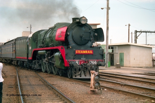 162-1-21
Spencer Street Station, broad gauge Steamrail R class R 766 North British Locomotive Company, Glasgow, Scotland model Hudson serial 27056 departs platform 4 with a down steam hauled passenger train during the PTC open Day, ground dwarf 155.
Keywords: R-class;R766;North-British-Locomotive-Company;Hudson;27056;
