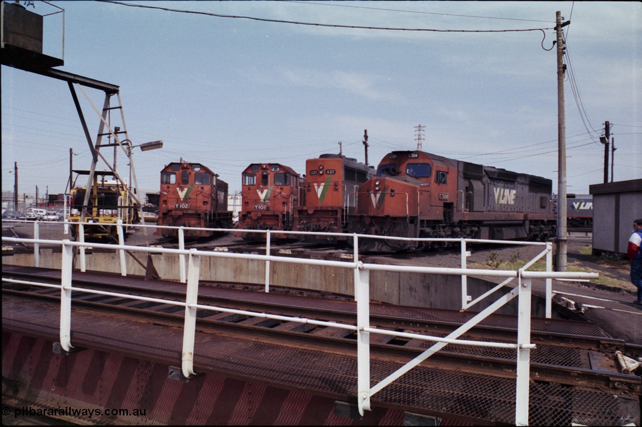 162-2-08
South Dynon Motive Power Depot, standard gauge turntable, radial roads and pit, V/Line locomotives lined up are Y class Y 102 Clyde Engineering EMD model G6B serial 63-292, Y class leader Y 101 serial 63-291, X class X 37 Clyde Engineering EMD model G26C serial 70-700 and C class C 504 Clyde Engineering EMD model GT26C serial 76-827. PTC Open Day.
Keywords: C-class;C504;Clyde-Engineering-Rosewater-SA;EMD;GT26C;76-827;