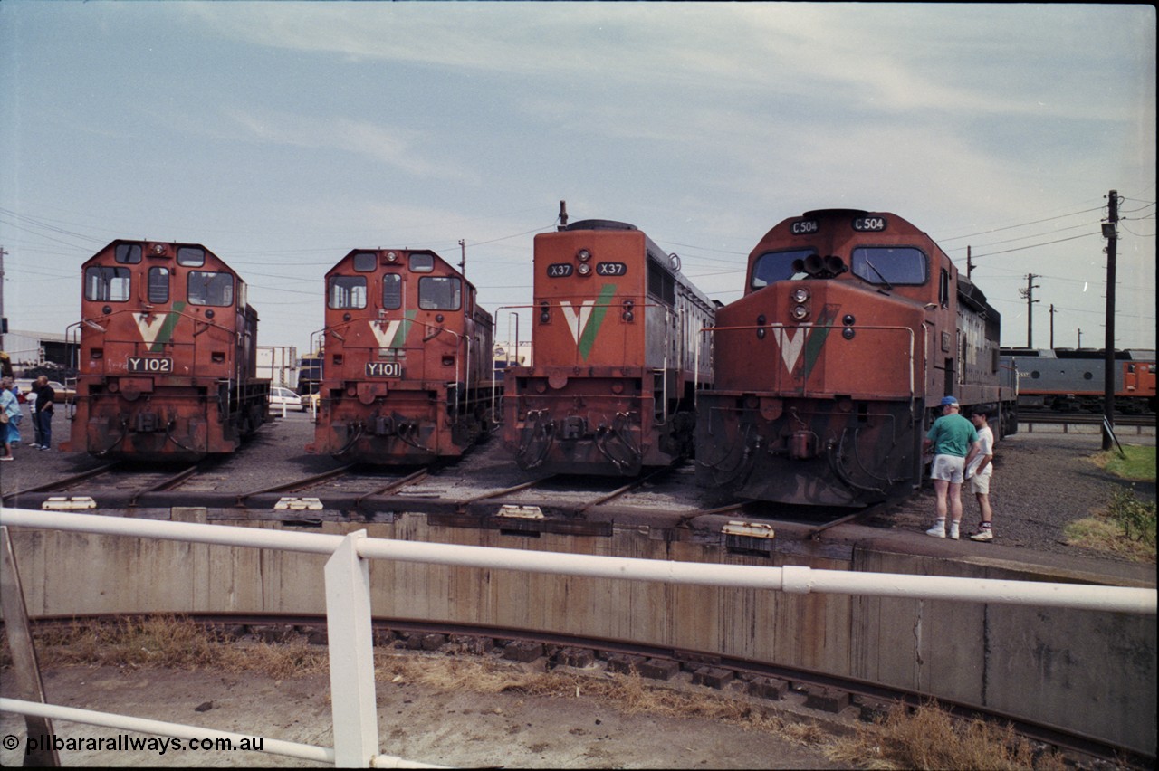 162-2-10
South Dynon Motive Power Depot, standard gauge turntable, radial roads and pit, V/Line locomotives lined up are Y class Y 102 Clyde Engineering EMD model G6B serial 63-292, Y class leader Y 101 serial 63-291, X class X 37 Clyde Engineering EMD model G26C serial 70-700 and C class C 504 Clyde Engineering EMD model GT26C serial 76-827. PTC Open Day.
Keywords: C-class;C504;Clyde-Engineering-Rosewater-SA;EMD;GT26C;76-827;