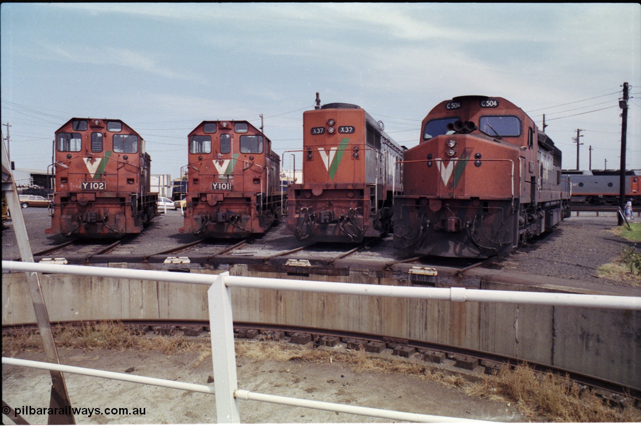 162-2-12
South Dynon Motive Power Depot, standard gauge turntable, radial roads and pit, V/Line locomotives lined up are Y class Y 102 Clyde Engineering EMD model G6B serial 63-292, Y class leader Y 101 serial 63-291, X class X 37 Clyde Engineering EMD model G26C serial 70-700 and C class C 504 Clyde Engineering EMD model GT26C serial 76-827. PTC Open Day.
Keywords: C-class;C504;Clyde-Engineering-Rosewater-SA;EMD;GT26C;76-827;