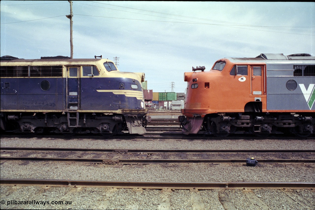 162-2-16
South Dynon Motive Power Depot, V/Line broad gauge 'Bulldog' locomotives nose to nose, with B class B 75 Clyde Engineering EMD model ML2 serial ML2-16 in near original Victorian Railways livery and condition and rebuilt sister A 81 Clyde Engineering EMD model AAT22C-2R serial 85-1189 rebuilt from B class B 81 Clyde Engineering EMD model ML2 serial ML2-22, PTC Open Day.
Keywords: B-class;B75;Clyde-Engineering-Granville-NSW;EMD;ML2;ML2-16;bulldog;