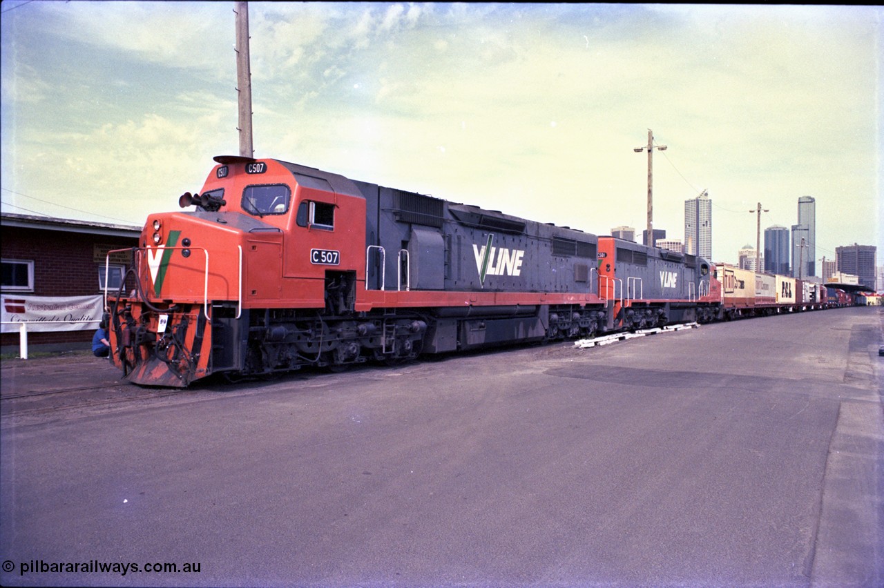 162-3-03
Melbourne Yard, a pair of V/Line broad gauge diesel electric locomotives, C classes C 507 Clyde Engineering EMD model GT26C serial 76-830 and C 501 'George Brown' serial 76-824 lead a display of waggons reaching back to No.10 Goods Shed at the PTC Open Day, Melbourne skyline in the background.
Keywords: C-class;C507;Clyde-Engineering-Rosewater-SA;EMD;GT26C;76-830;