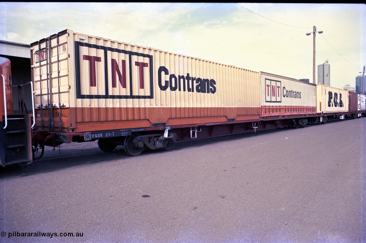 162-3-07
Melbourne Yard, V/Line broad gauge VQDW type 80 foot bogie container waggon, built by Newport Workshops in September 1975 as an FCF Bogie Jumbo Container Flat, VQDW 23 with TNT Contrans 40 foot containers, PTC Open Day.
Keywords: VQDW-type;VQDW23T;Victorian-Railways-Newport-WS;FCF-type;