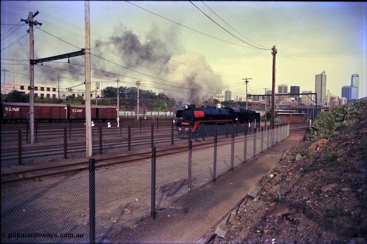 162-3-18
Melbourne Yard, Steamrail R class R 761 North British Locomotive Company, Glasgow, Scotland model Hudson serial 27051 reverses back to Spencer Street having run around the reversing loop, PTC Open Day.
Keywords: R-class;R761;North-British-Locomotive-Company;Hudson;27051;