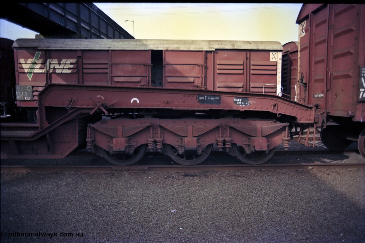 162-3-21
Melbourne Yard, broad gauge VWCF type bogie 60 ton well waggon VWCF 1, originally built at Newport Workshops 10-1925 as QB type QB 13, coded to QWF 1 in 1962, side view of three axle bogie, stored, VLCX type bogie louvre van VLCX 113 behind.
Keywords: VWCF-type;VWCF1;Victorian-Railways-Newport-WS;QB-type;QWF-type;VLCX-type;VLCX113;