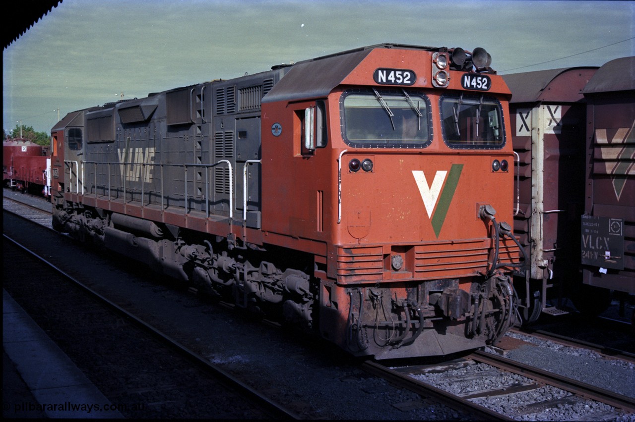 162-3-25
Seymour, stabled V/Line diesel electric locomotive N class N 452 'Rural City of Wodonga' Clyde Engineering EMD model JT22HC-2 serial 85-1220 sits opposite the station building waiting to run the Sunday evening down Cobram passenger train, beside it is stabled down Wodonga goods train 9303.
Keywords: N-class;N452;Clyde-Engineering-Somerton-Victoria;EMD;JT22HC-2;85-1220;