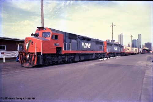 162-3-03
Melbourne Yard, a pair of V/Line broad gauge diesel electric locomotives, C classes C 507 Clyde Engineering EMD model GT26C serial 76-830 and C 501 'George Brown' serial 76-824 lead a display of waggons reaching back to No.10 Goods Shed at the PTC Open Day, Melbourne skyline in the background.
Keywords: C-class;C507;Clyde-Engineering-Rosewater-SA;EMD;GT26C;76-830;
