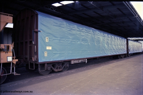 162-3-13
Melbourne Yard, No.10 Goods Shed, PTC Open Day, V/Line broad gauge VFNX type bogie tarpaulin covered roll paper waggon VFNX 3 with new looking blue tarpaulin, coupled to sister waggon, built new in May 1979 at Newport Workshops.
Keywords: VFNX-type;VFNX3;Victorian-Railways-Newport-WS;