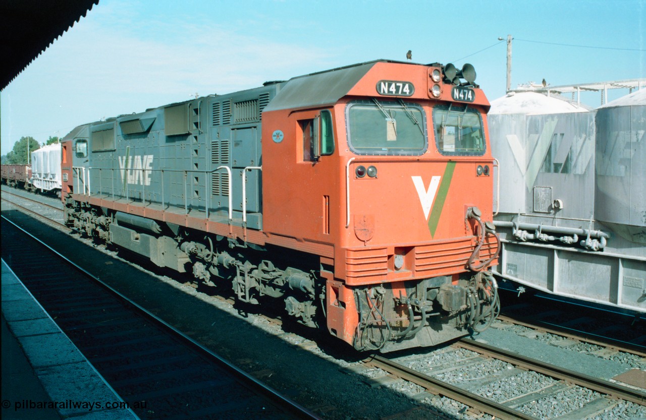 163-08
Seymour station yard, platform view, V/Line broad gauge N class loco N 474 'City of Traralgon' Clyde Engineering EMD model JT22HC-2 serial 87-1203 is stabled awaiting the Sunday night combined down Albury / Cobram passenger train which splits here with N 474 running to portion to Cobram, next to it is the tail end of a stabled down Wodonga goods train.
Keywords: N-class;N474;Clyde-Engineering-Somerton-Victoria;EMD;JT22HC-2;87-1203;