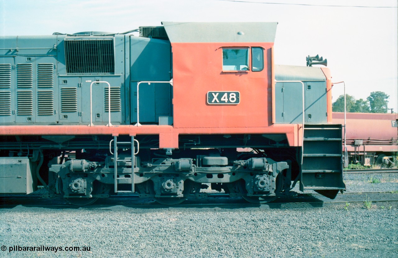 163-12
Seymour loco depot, V/Line broad gauge third series X class X 48 Clyde Engineering EMD model G26C serial 75-795, cab side detail view, the wind deflector is clearly evident in this shot.
Keywords: X-class;X48;Clyde-Engineering-Rosewater-SA;EMD;G26C;75-795;