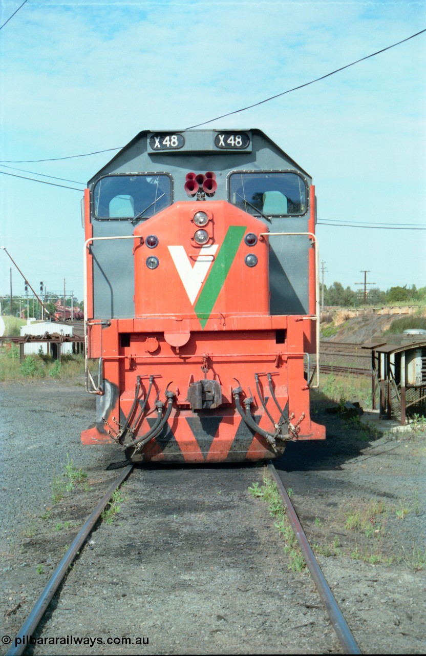 163-14
Seymour loco depot, V/Line broad gauge locomotives third series X class X 48 Clyde Engineering EMD model G26C serial 75-795, cab front on view, wind deflectors are clearly visible on each side of the cab.
Keywords: X-class;X48;Clyde-Engineering-Rosewater-SA;EMD;G26C;75-795;