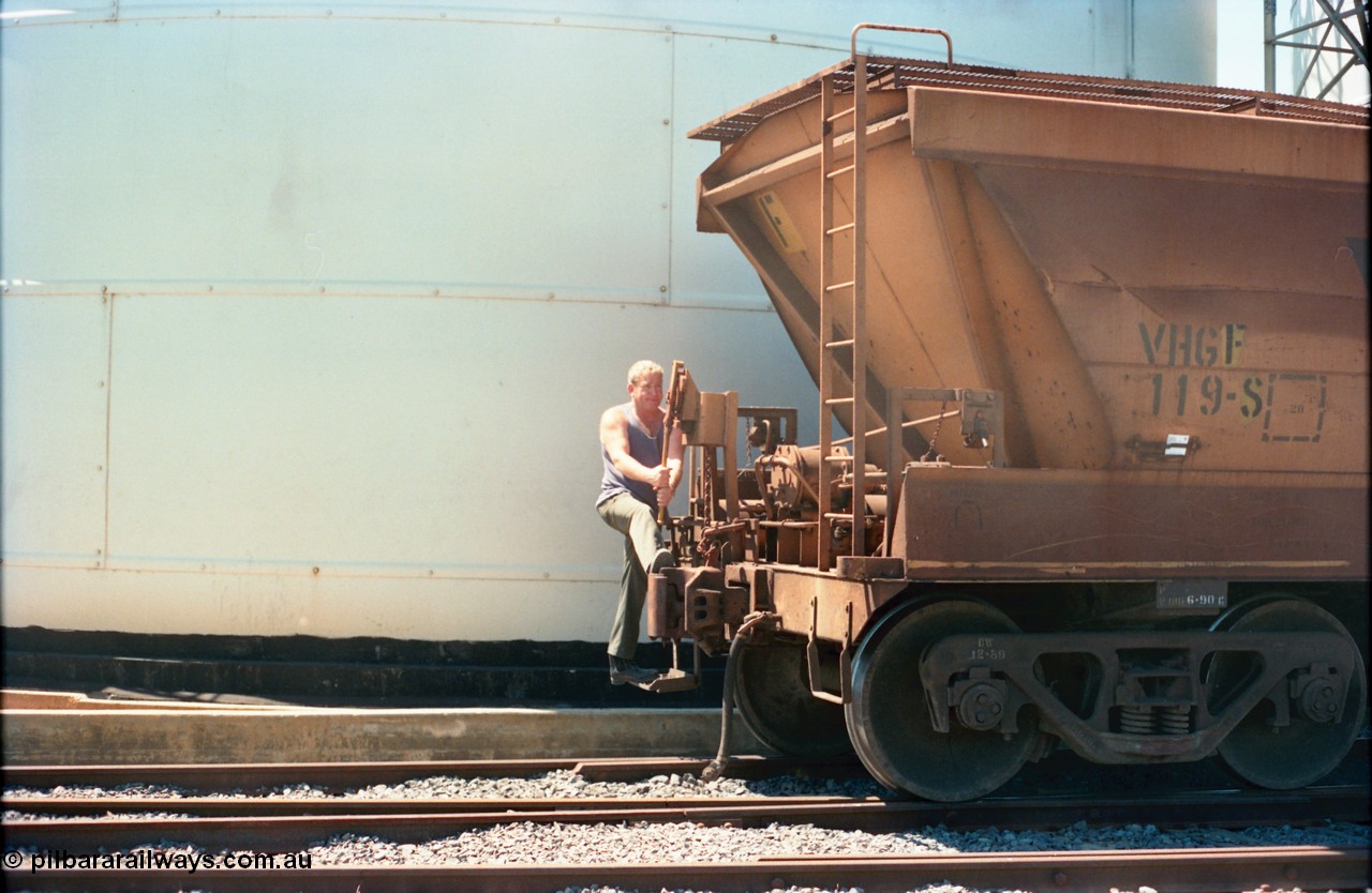 164-15
Murchison East, broad gauge V/Line Grain VHGF type bogie grain waggon VHGF 119, built as a GJX type by Steelweld Victoria in January 1969, showing signs of being recoded from VHGY has a GEB worker operating the lever action handbrake as the rake is moved down the road under its' own weight.
Keywords: VHGF-type;VHGF119;Steelweld-Vic;GJX-type;