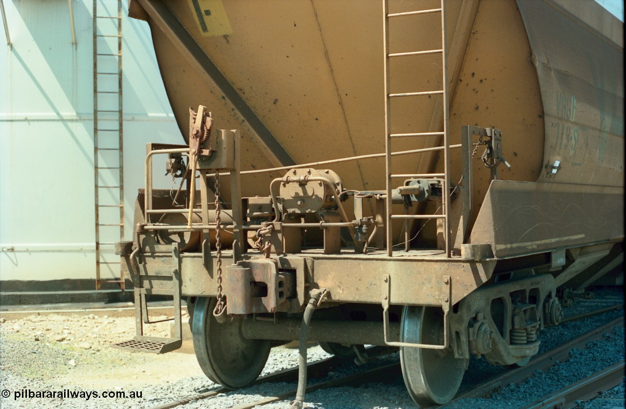 164-17
Murchison East, the handbrake and brake control end of broad gauge V/Line Grain VHGF type bogie grain waggon VHGF 119, built as a GJX type by Steelweld Victoria in January 1969, shows detail of shunters step, lever ratchet handbrake, air receiver and cylinder, rigging and load compensation lever.
Keywords: VHGF-type;VHGF119;Steelweld-Vic;GJX-type;