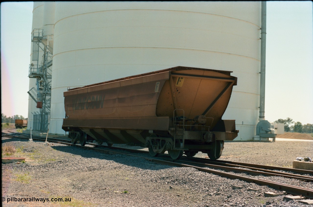 164-18
Murchison East, V/Line Grain VHGF type bogie grain waggon VHGF 119, built as a GJX type by Steelweld Victoria in January 1969, is loose shunted down the gravitational road loaded towards the loaded rake, rolling past the Ascom Jumbo silo complex, show non-handbrake end of waggon.
Keywords: VHGF-type;VHGF119;Steelweld-Vic;GJX-type;