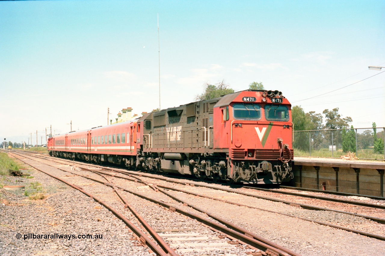 164-21
Murchison East, V/Line broad gauge N class loco N 471 'City of Benalla' Clyde Engineering EMD model JT22HC-2 serial 87-1200 with the standard N set and D van with the down Cobram passenger train paused at the platform, tracks in foreground have seen recent re-sleepering and ballasting work.
Keywords: N-class;N471;Clyde-Engineering-Somerton-Victoria;EMD;JT22HC-2;87-1200;