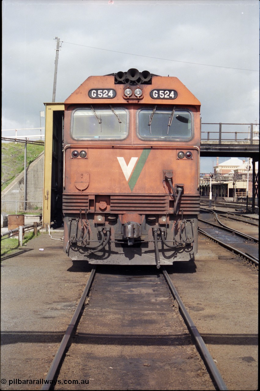 165-14
Albury loco depot, fuel point, standard gauge V/Line G class G 524 Clyde Engineering EMD model JT26C-2SS serial 86-1237, can front view, station beyond on the right.
Keywords: G-class;G524;Clyde-Engineering-Rosewater-SA;EMD;JT26C-2SS;86-1237;