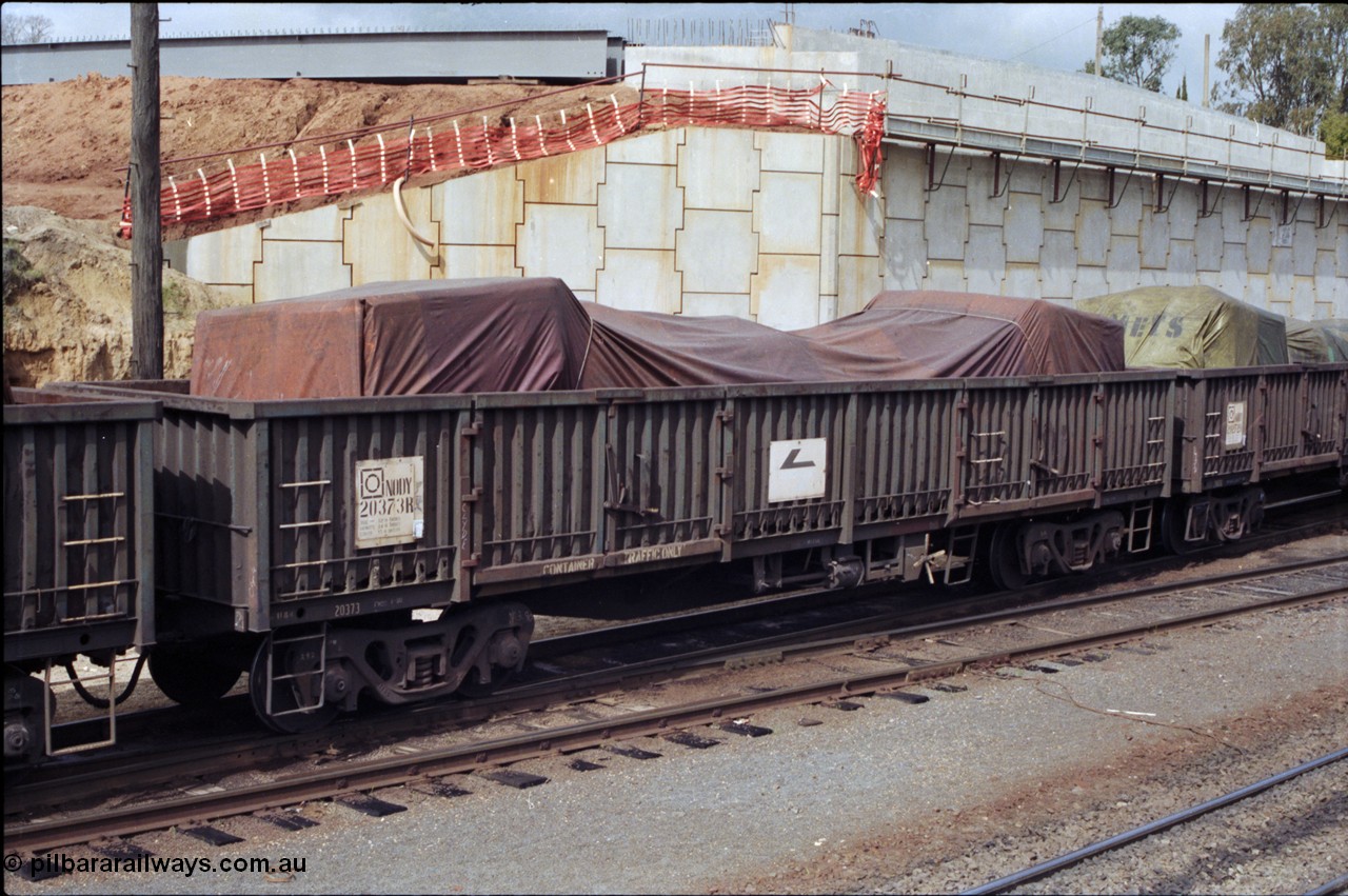 165-19
Albury yard, NSWSRA standard gauge NODY type bogie open waggon NODY 20373 with a tarped load.
Keywords: NODY-type;NODY20373;