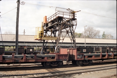 165-25
Albury yard view with Demag transhipping gantry crane with 30 ton spreader bar for lift steel slabs, trans-shipping shed, V/Line broad gauge bogie slab steel waggons of the VKEX class VKEX 1 and NSWSRA NRJY class in the background

