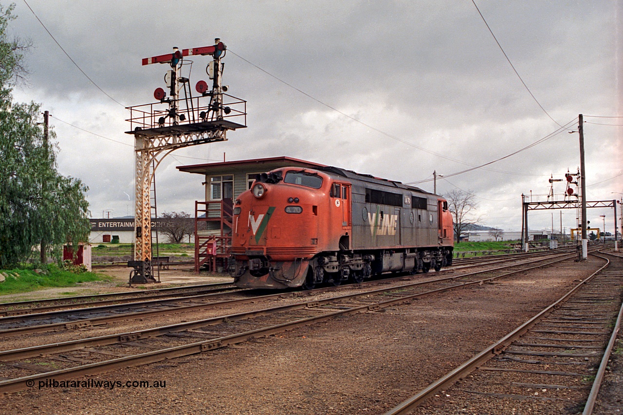 166-01
Wodonga, V/Line broad gauge A class loco A 70 Clyde Engineering EMD model AAT22C-2R serial 84-1187 rebuilt from B class B 70 Clyde Engineering EMD model ML2 serial ML2-11 shunts out light engine past A signal box and semaphore signal post 19.
Keywords: A-class;A70;Clyde-Engineering-Rosewater-SA;EMD;AAT22C-2R;84-1187;rebuild;bulldog;