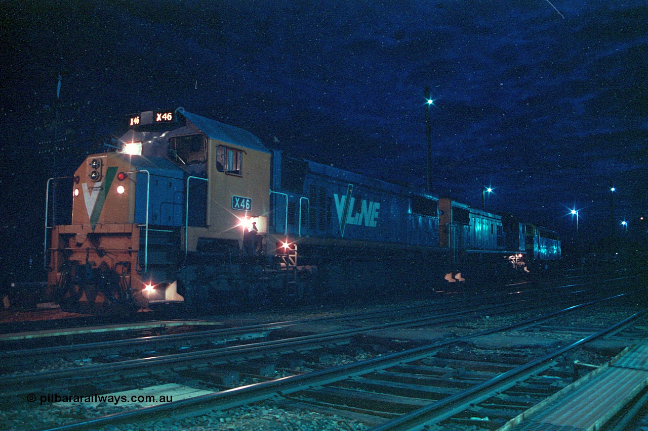 166-13
Benalla, night time yard view of V/Line broad gauge up Long Island slab steel train 9334 behind X classes X 46 and X 45 'Edgar H Brownbill' Clyde Engineering EMD models G26C serials 75-793 and 75-792 with veteran B class Bulldog B 75 Clyde Engineering EMD model ML2 serial ML2-16 as it waits to cross passenger trains before heading south.
Keywords: X-class;X46;Clyde-Engineering-Rosewater-SA;EMD;G26C;75-793;