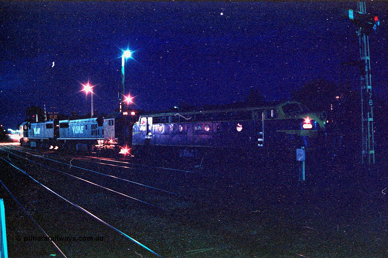 166-14
Benalla, night time yard view of V/Line broad gauge up Long Island slab steel train 9334 behind X classes X 46 and X 45 'Edgar H Brownbill' Clyde Engineering EMD models G26C serials 75-793 and 75-792 with veteran B class Bulldog B 75 Clyde Engineering EMD model ML2 serial ML2-16 as it waits to cross passenger trains before heading south.
Keywords: B-class;B75;Clyde-Engineering-Granville-NSW;EMD;ML2;ML2-16;bulldog;