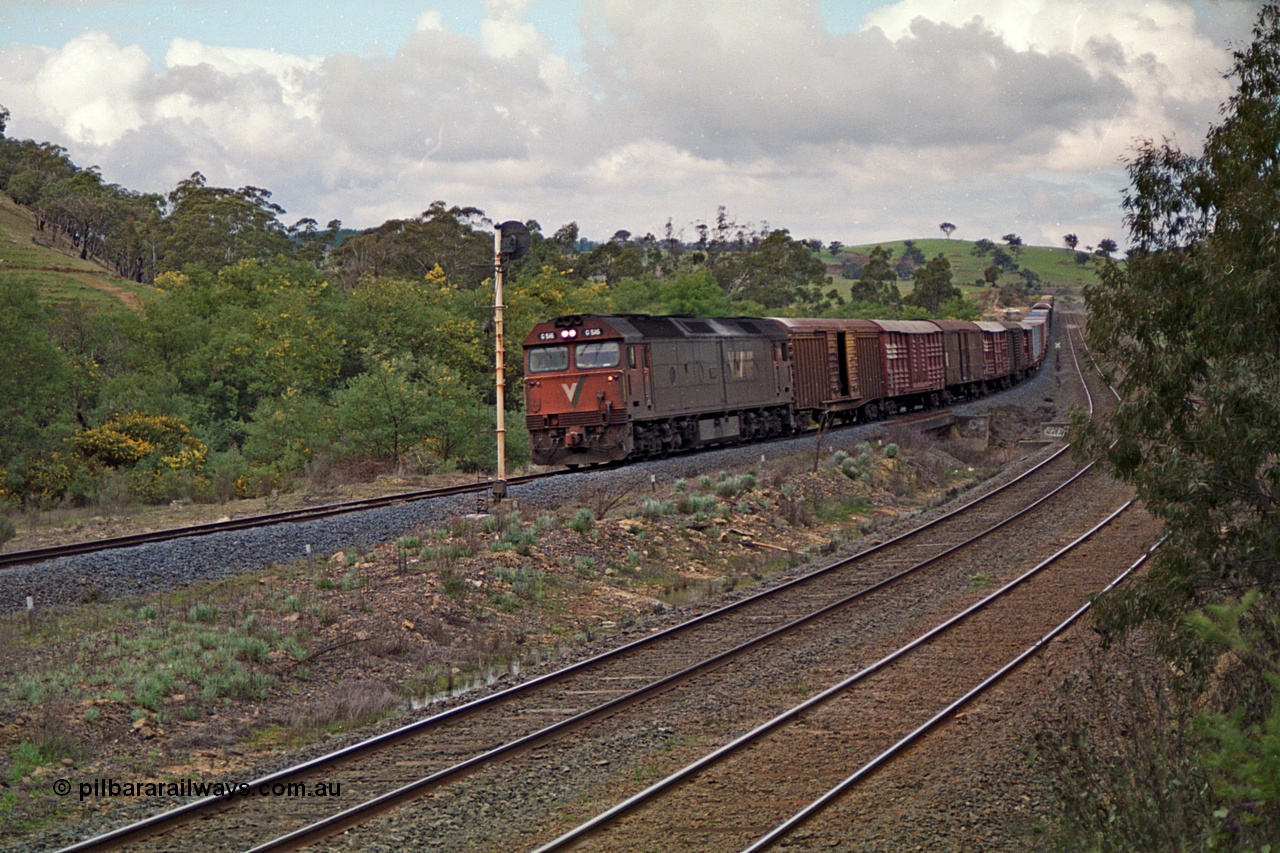 166-16
Wandong, down V/Line standard gauge goods train powered by G class locomotive G 516 Clyde Engineering EMD model JT26C-2SS serial 85-1229 roars across Broadhurst Creek at searchlight signal post ES1951.
Keywords: G-class;G516;Clyde-Engineering-Rosewater-SA;EMD;JT26C-2SS;85-1229;