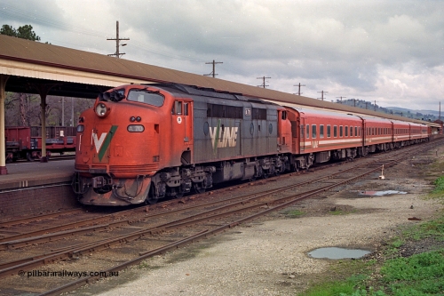 166-03
Albury, V/Line broad gauge A class A 70 Clyde Engineering EMD model AAT22C-2R serial 84-1187 rebuilt from B class B 70 Clyde Engineering EMD model ML2 serial ML2-11 arrives at the Victorian platform with an empty carriage set to work an up passenger train to Melbourne.
Keywords: A-class;A70;Clyde-Engineering-Rosewater-SA;EMD;AAT22C-2R;84-1187;rebuild;bulldog;