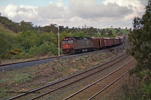 166-16
Wandong, down V/Line standard gauge goods train powered by G class locomotive G 516 Clyde Engineering EMD model JT26C-2SS serial 85-1229 roars across Broadhurst Creek at searchlight signal post ES1951.
Keywords: G-class;G516;Clyde-Engineering-Rosewater-SA;EMD;JT26C-2SS;85-1229;