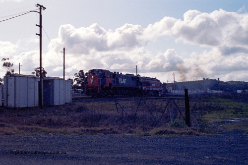 166-24
Wallan, Wallan Loop, V/Line standard gauge X class locomotive X 37 Clyde Engineering EMD model G26C serial 70-700 tows damaged NSWSRA XPT power car XP 2007 'City of Albury' to Melbourne, August 28, 1991. XP 2007 was damaged at Henty on May 3.
Keywords: X-class;X37;Clyde-Engineering-Granville-NSW;EMD;G26C;70-700;