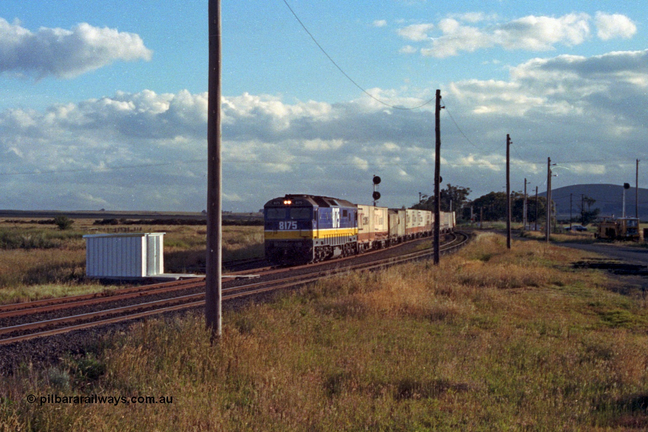 167-02
Wallan Loop south end of standard gauge loop, standard gauge gangers trolley shed, NSWSRA 81 class loco 8175 Clyde Engineering EMD model JT26C-2SS serial 85-1094 in new Freight Rail 'Stealth' livery takes the loop road with a north bound goods service, broad gauge tracks and tamper at right.
Keywords: 81-class;8175;Clyde-Engineering-Kelso-NSW;EMD;JT26C-2SS;85-1094;