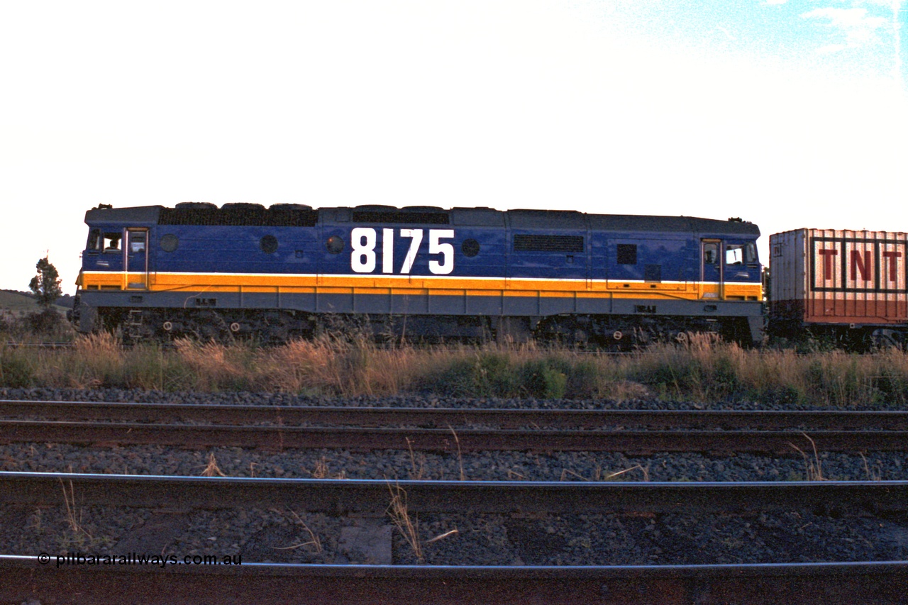 167-07
Wallan Loop, north end, near the Boundary Rd crossing, standard gauge NSWSRA 81 class loco 8175 Clyde Engineering EMD model JT26C-2SS serial 85-1094 in the new Freight Rail 'Stealth' livery holds the loop while a broad gauge V/Line A class races south with an up passenger train, signal gantry and post for loop visible.
Keywords: 81-class;8175;Clyde-Engineering-Kelso-NSW;EMD;JT26C-2SS;85-1094;