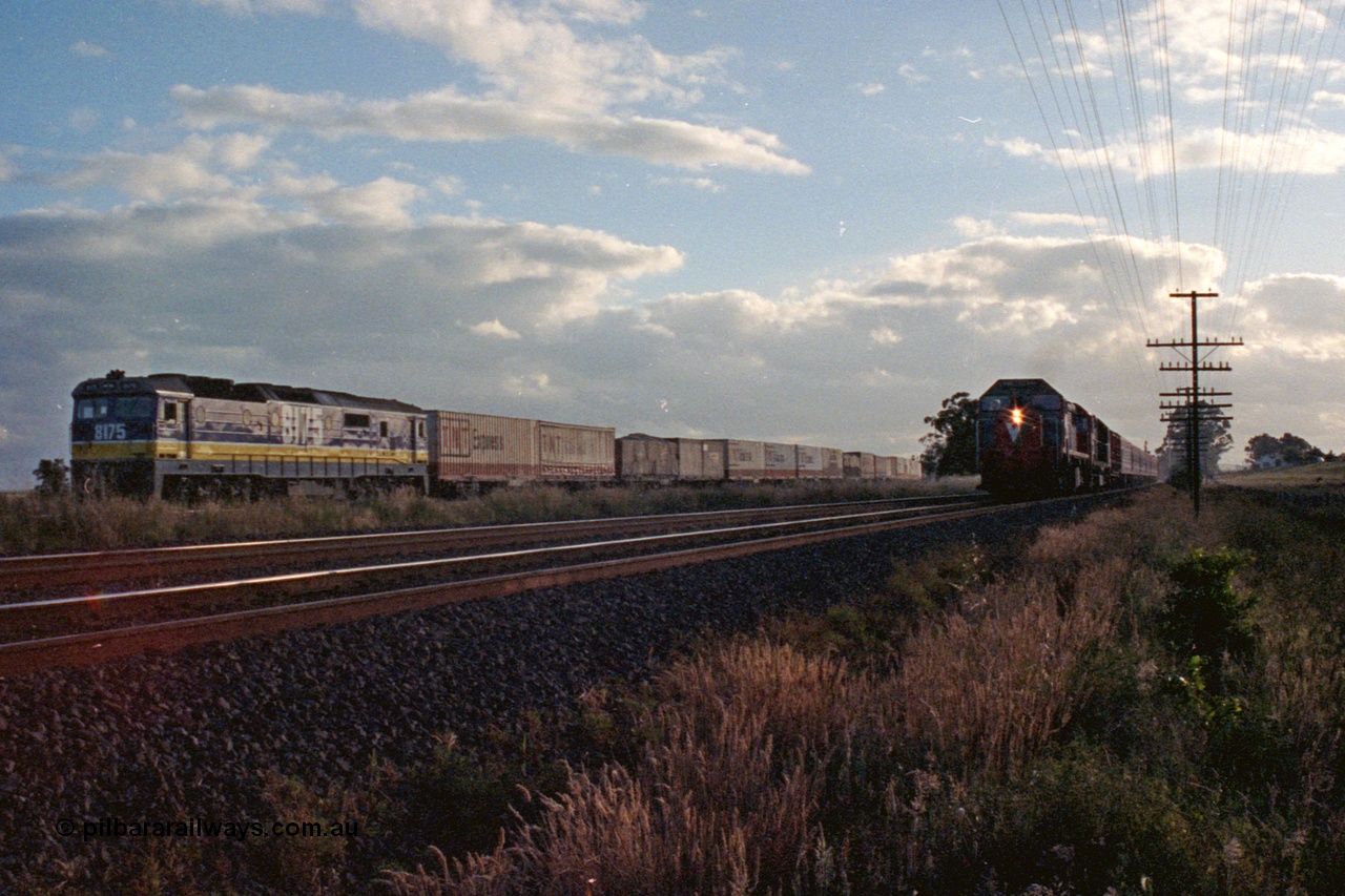 167-08
Wallan Loop, north end, standard gauge NSWSRA 81 class loco 8175 Clyde Engineering EMD model JT26C-2SS serial 85-1094 in the new Freight Rail 'Stealth' livery holds the loop while broad gauge V/Line X and N classes blast north with a down passenger train on the broad gauge tracks.
Keywords: 81-class;8175;Clyde-Engineering-Kelso-NSW;EMD;JT26C-2SS;85-1094;