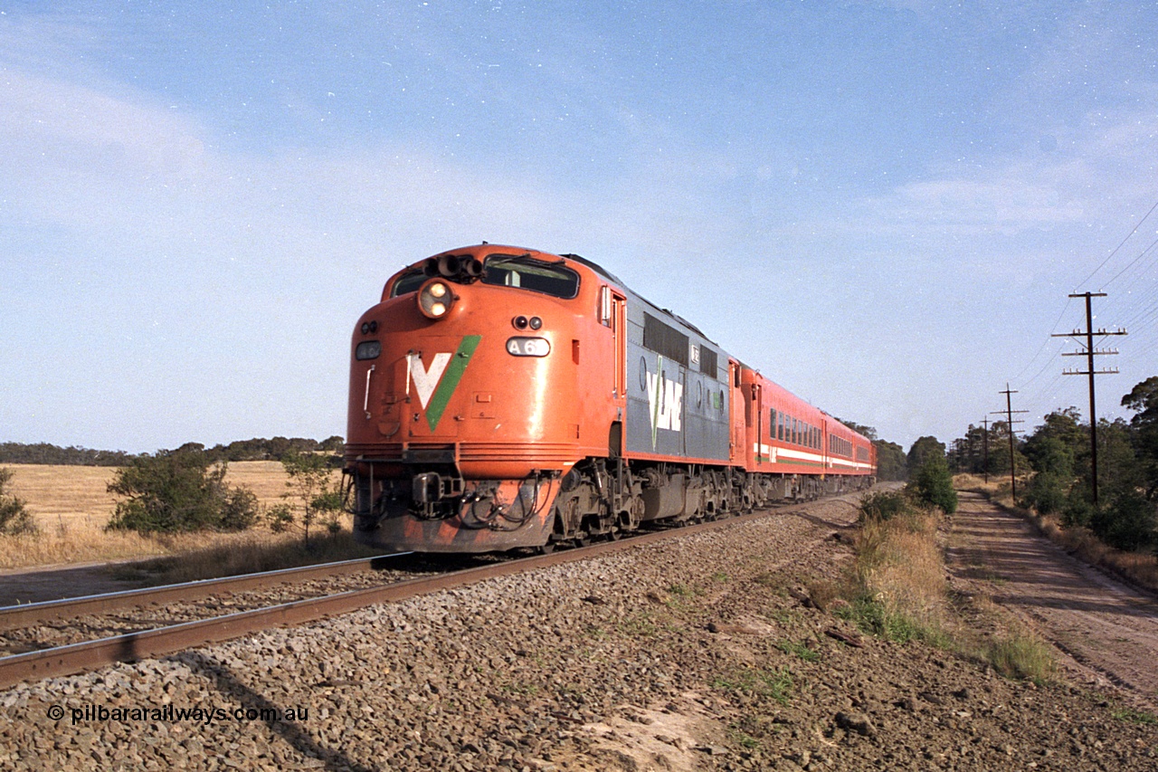 168-02
Bank Box Loop, down broad gauge V/Line passenger service powered by rebuilt A class Bulldog A 62 Clyde Engineering EMD model AAT22C-2R serial 84-1183 rebuilt from B class B 62 Clyde Engineering EMD model ML2 serial ML2-3 with N set and D van at Ironbark Road grade crossing.
Keywords: A-class;A62;Clyde-Engineering-Rosewater-SA;EMD;AAT22C-2R;84-1183;rebuild;bulldog;