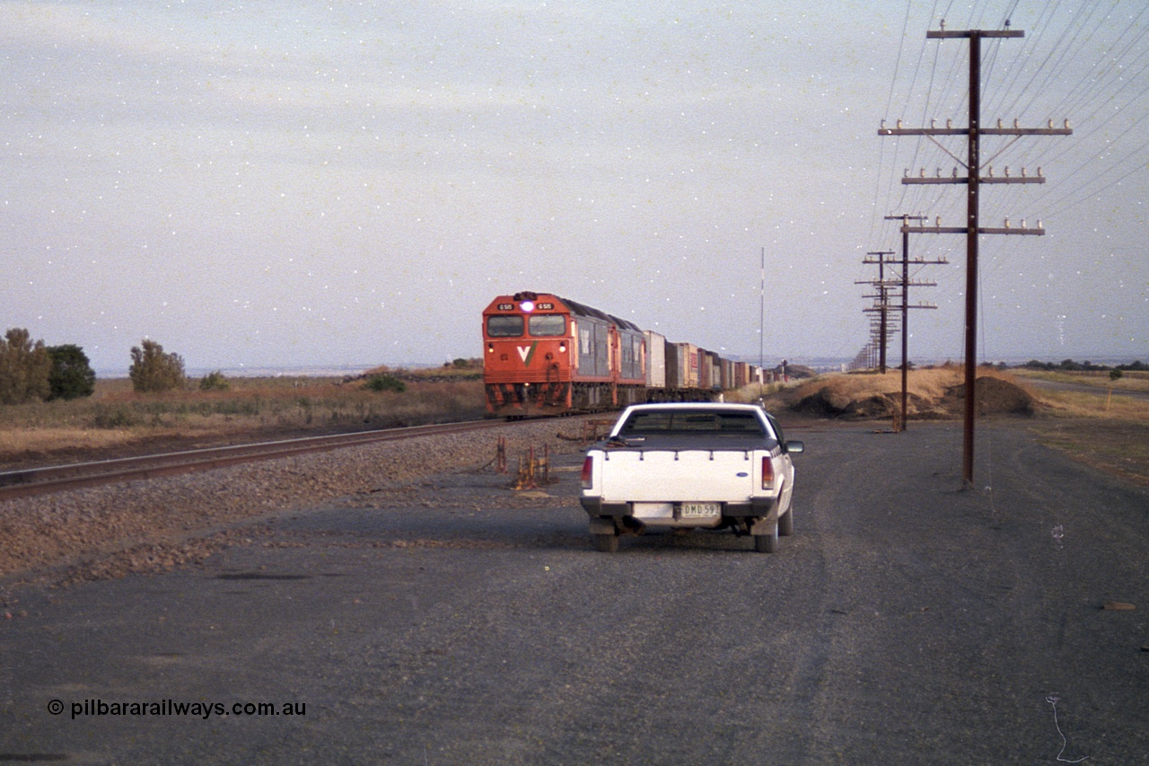 168-13
Bank Box Loop, climbing the grade in the distance looking towards Bacchus Marsh are a pair of V/Line G class units with an Adelaide bound freighter.
Keywords: G-class;G515;Clyde-Engineering-Rosewater-SA;EMD;JT26C-2SS;85-1243;