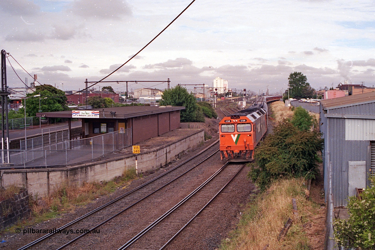 168-21
West Footscray, looking west toward Tottenham at broad gauge separation junction, V/Line standard gauge G class Co-Co locomotive G 518 Clyde Engineering EMD model JT26C-2SS serial 85-1231 leads the up Melbourne Express passenger service from Sydney.
Keywords: G-class;G518;Clyde-Engineering-Rosewater-SA;EMD;JT26C-2SS;85-1231;