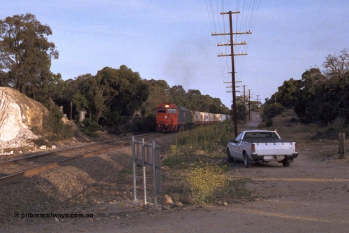 168-08
Bank Box Loop, down V/Line broad gauge goods train to Adelaide with G class G 540 Clyde Engineering EMD model JT26C-2SS serial 89-1273 and Australian National 700 class 704 AE Goodwin ALCo model DL500G serial G6059-2 power away from the crossing loop at the Ironbark Road grade crossing.
Keywords: G-class;G540;Clyde-Engineering-Somerton-Victoria;EMD;JT26C-2SS;89-1273;