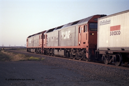 168-15
Bank Box Loop, broad gauge V/Line G class units G 515 Clyde Engineering EMD model JT26C-2SS serial 85-1243 leads G 529 serial 88-1259 with an Adelaide bound freighter.
Keywords: G-class;G529;Clyde-Engineering-Somerton-Victoria;EMD;JT26C-2SS;88-1259;