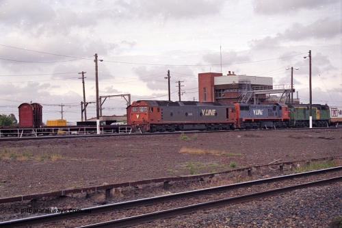 168-24
Tottenham Yard, an up broad gauge goods train with motive power from V/Line G class G 533 Clyde Engineering EMD model JT26C-2SS serial 88-1263, X class X 49 Clyde Engineering EMD model G26C serial 75-796 and Australian National 700 class 704 AE Goodwin ALCo model DL500G serial G6059-2 locomotives departs the yard for Melbourne.
Keywords: G-class;G533;Clyde-Engineering-Somerton-Victoria;EMD;JT26C-2SS;88-1263;