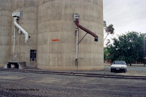 170-12
Devenish, load-out spouts on Williamstown style silo complex, track view, 1988 Ford XF Falcon ute.
